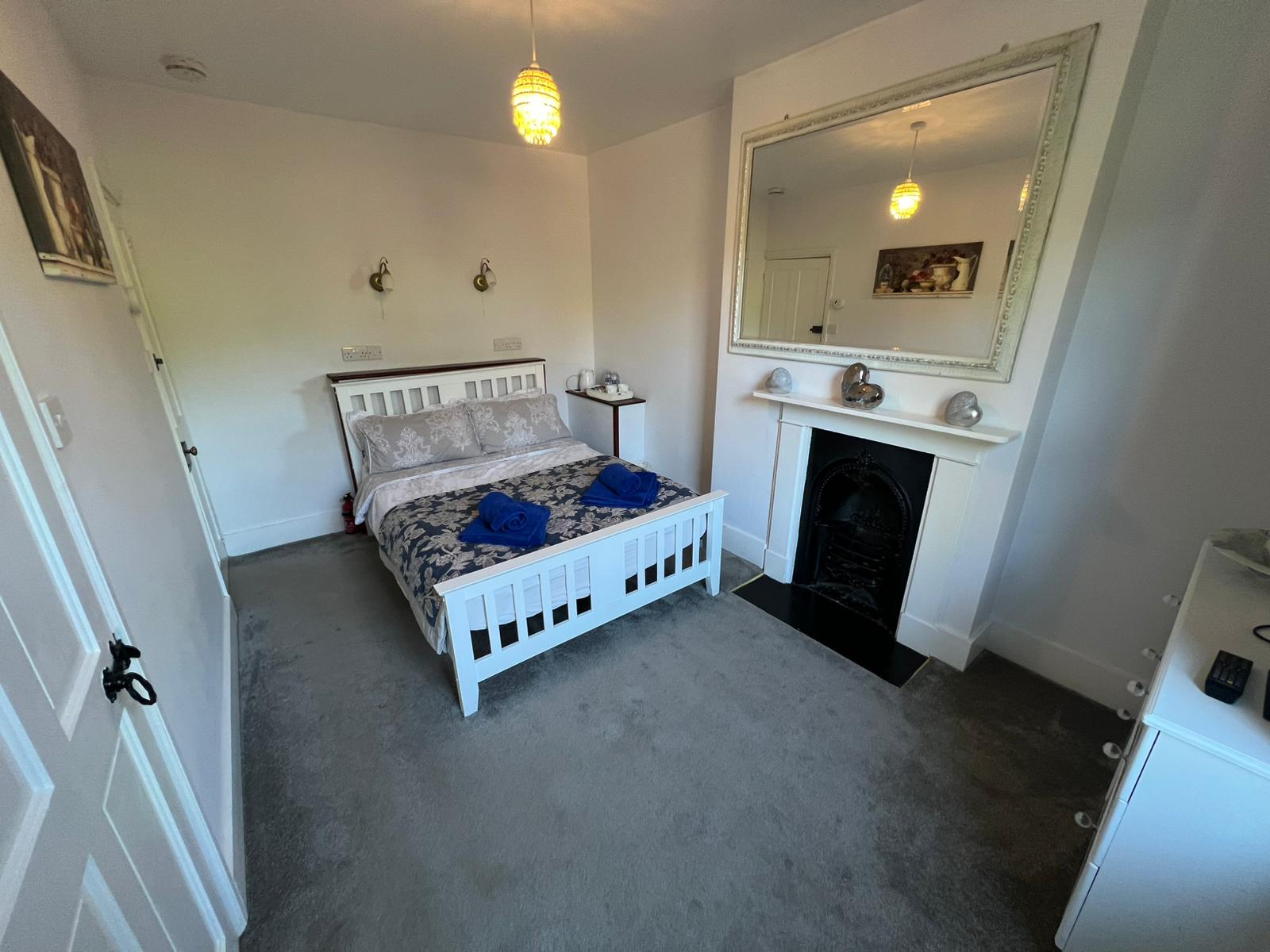 Double Room 5 — spacious layout with fireplace
